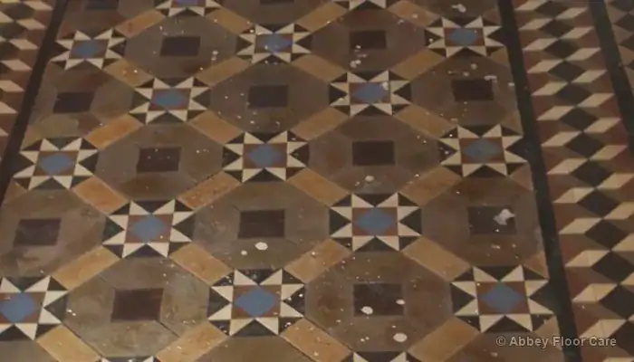 Victorian clay tile hallway in Blyth with paint marks and dull coating residue before cleaning