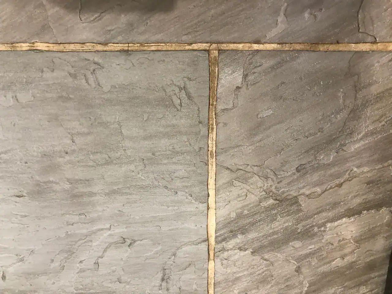 Professional slate floor restoration assessment before choosing cleaning, repair or sealing route