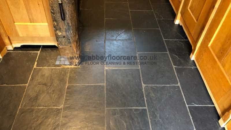 Patchy slate floor with dull areas after normal cleaning in a Hitchin home